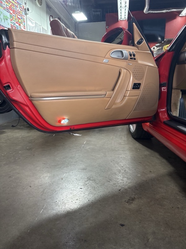 Leather door panel being installed at Sidco Upholstery