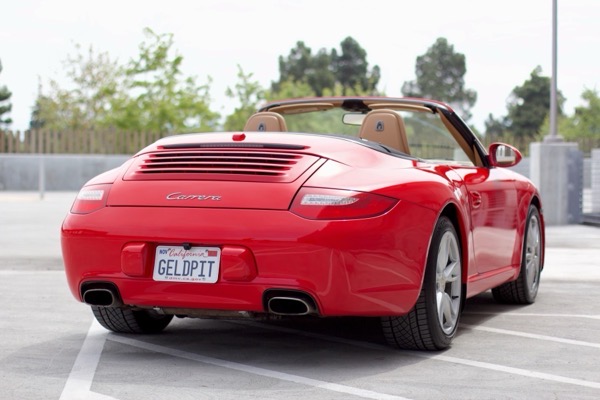 Rear three-quarter showing Carrera badge