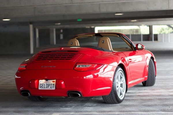 Rear three-quarter in garage, dramatic lighting